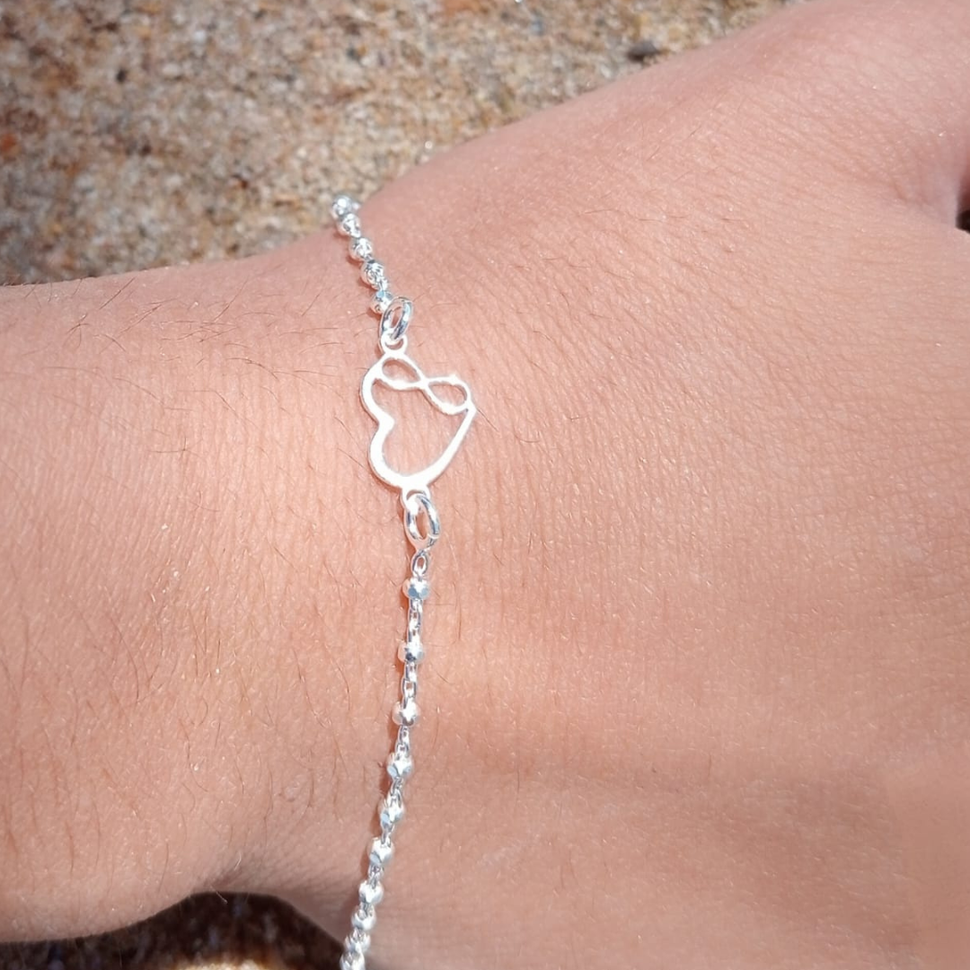 INFINITY AND HEART design bracelet.